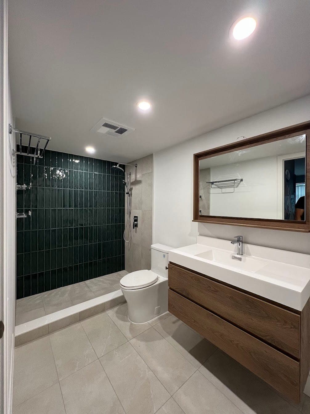 Yonge Street — emerald-tile bathroom